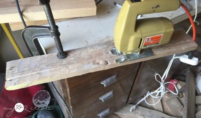 Trimming off a piece of pallet wood with a jigsaw