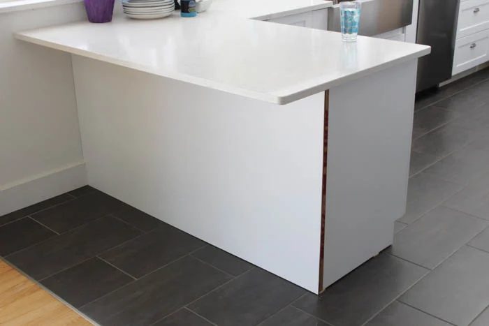 Planking-the-Kitchen-Island-Peninsula-and-adding-corbels-at-thehappyhousie.com-2