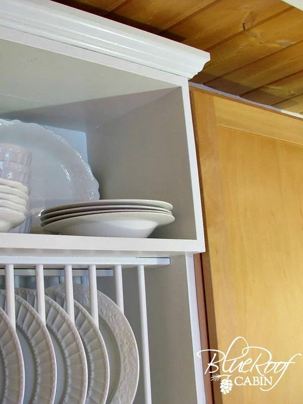 staggered shelves on the custom handmade plate rack cabinet