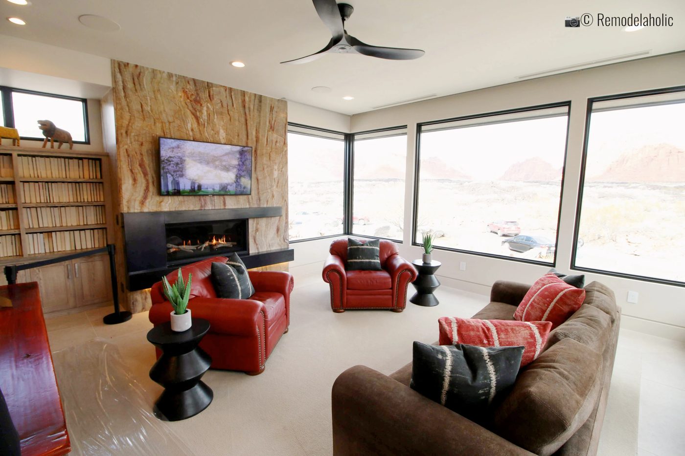 Red Accent chairs. SGPH 2019 House 15 Split Rock Custom Homes, Photo by Bekob