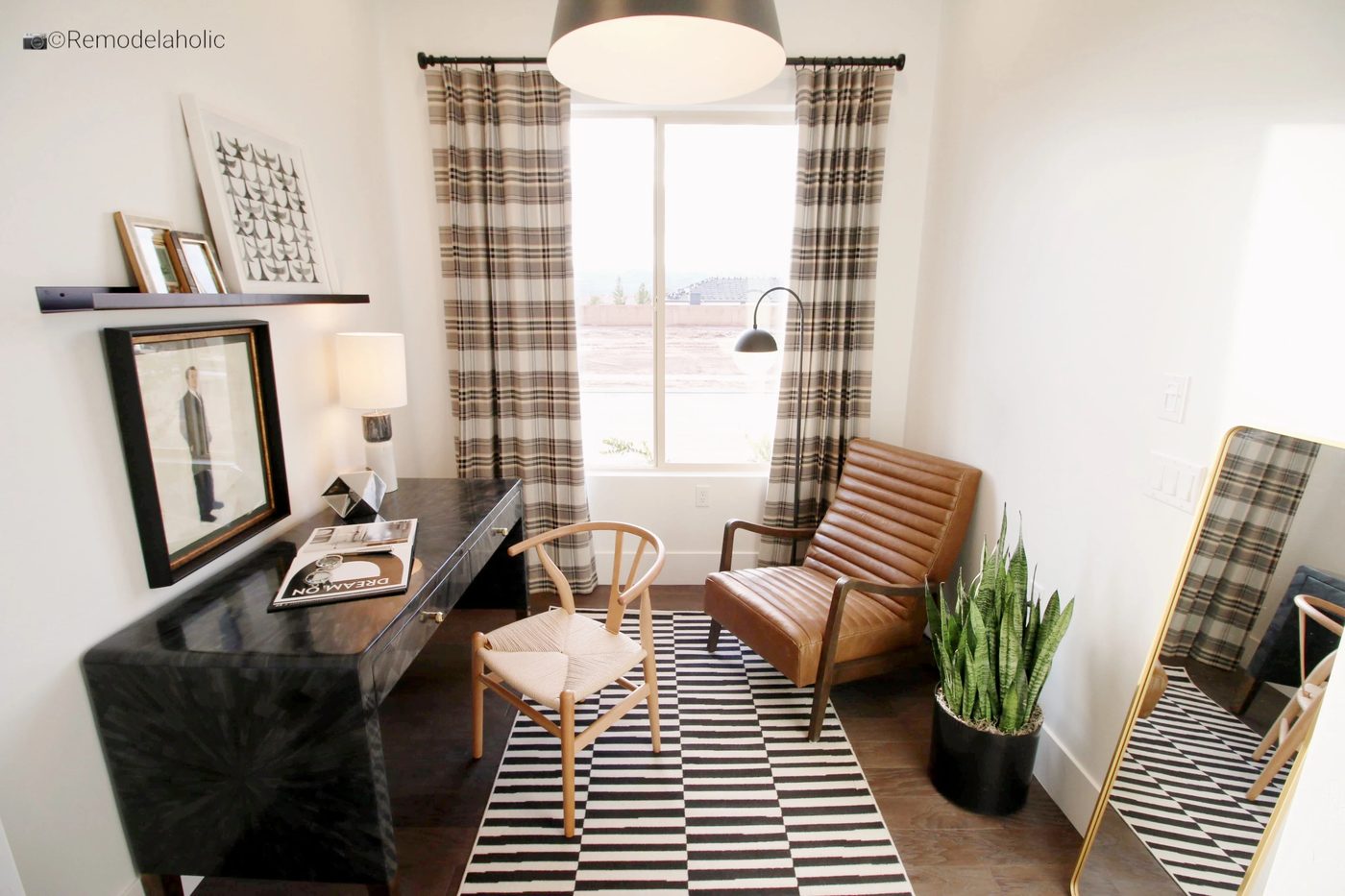 Home office design with upholstered accent chair. SGPH 2019 House 22 SunRiver Construction, LC, Photo by Bekob