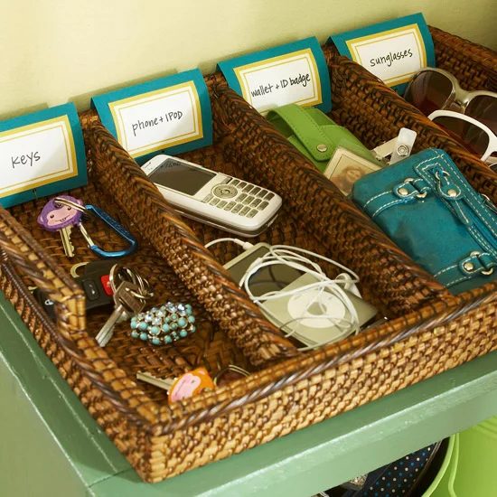 use a divided tray in an entryway drop zone to keep small things like phones, keys, and sunglasses organized, via IHeartOrganizing