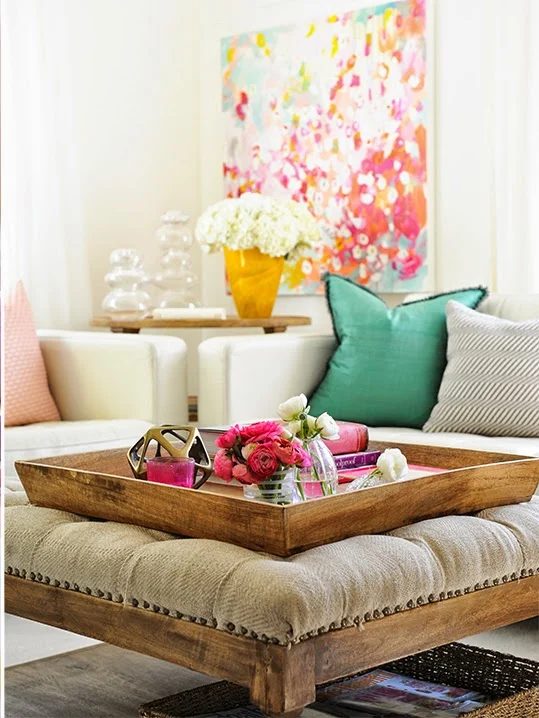 striking vibrant living room with wood upholstered ottoman and tray, Tracey Ayton via Decorology