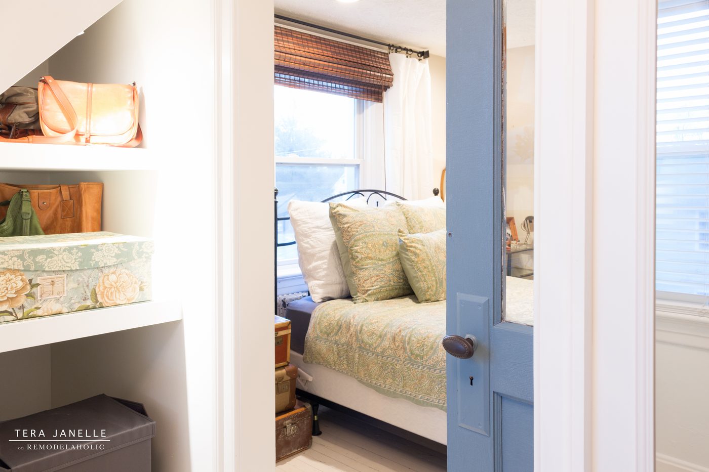 A striking travel-inspired master bedroom with an exposed brick wall and a striking built-in bookshelf and storage nook. Tera Janelle on Bekob.com