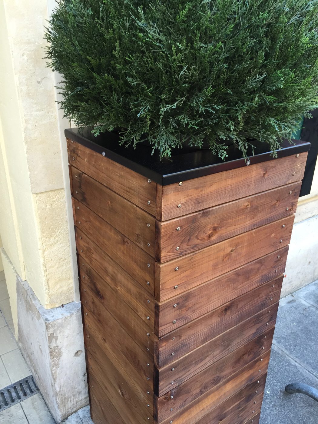 vivid tall wooden planter with metal screw head accents. 3 feet tall! Build it for $50, and of course I need 2...