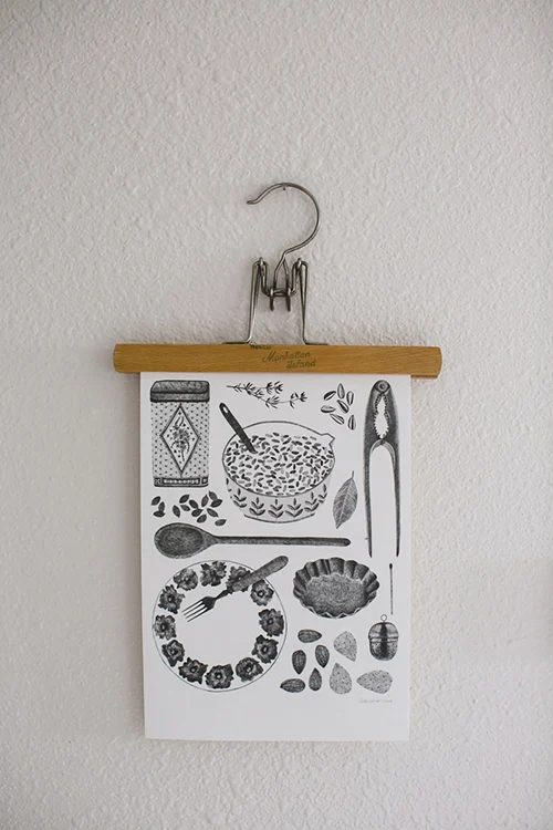 hang art prints or photos using an old pants hanger (via Apartment Therapy)