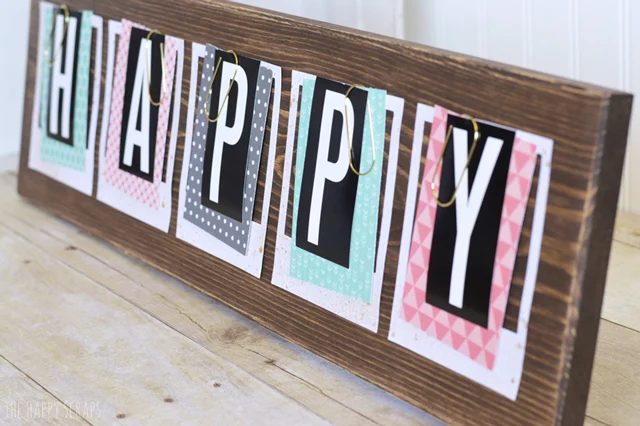 use oversized paper clips for a photo or art print display (The Happy Scraps)