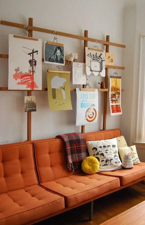 wood trellis and pants hangers art and photo display (PoppyTalk)
