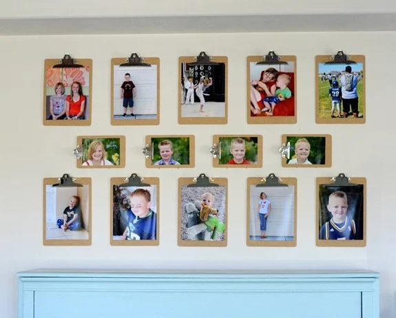 photo display using large and small clipboards (via Kristen Duke Photography)