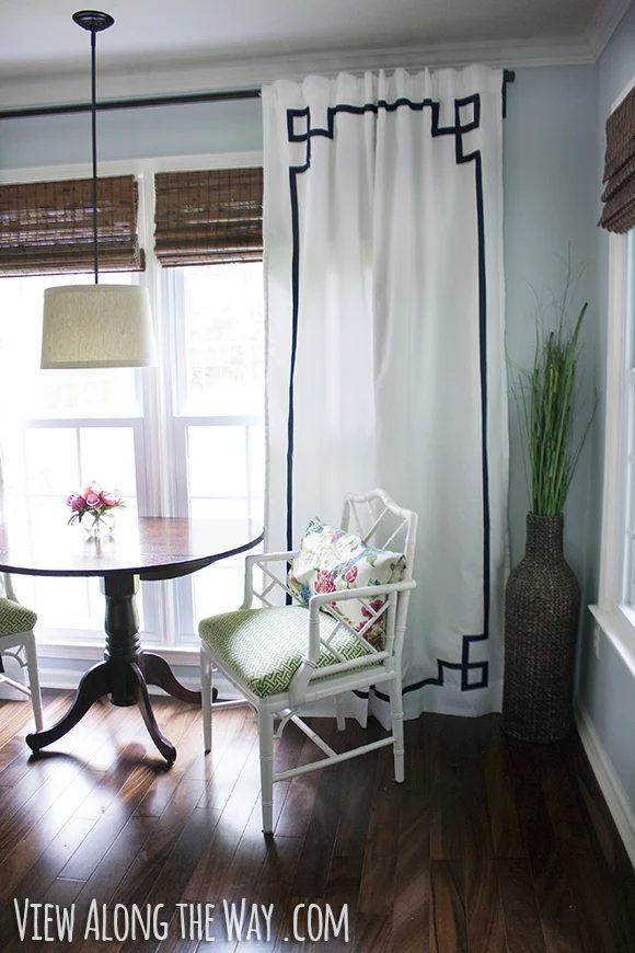 greek key panels with trim white curtains