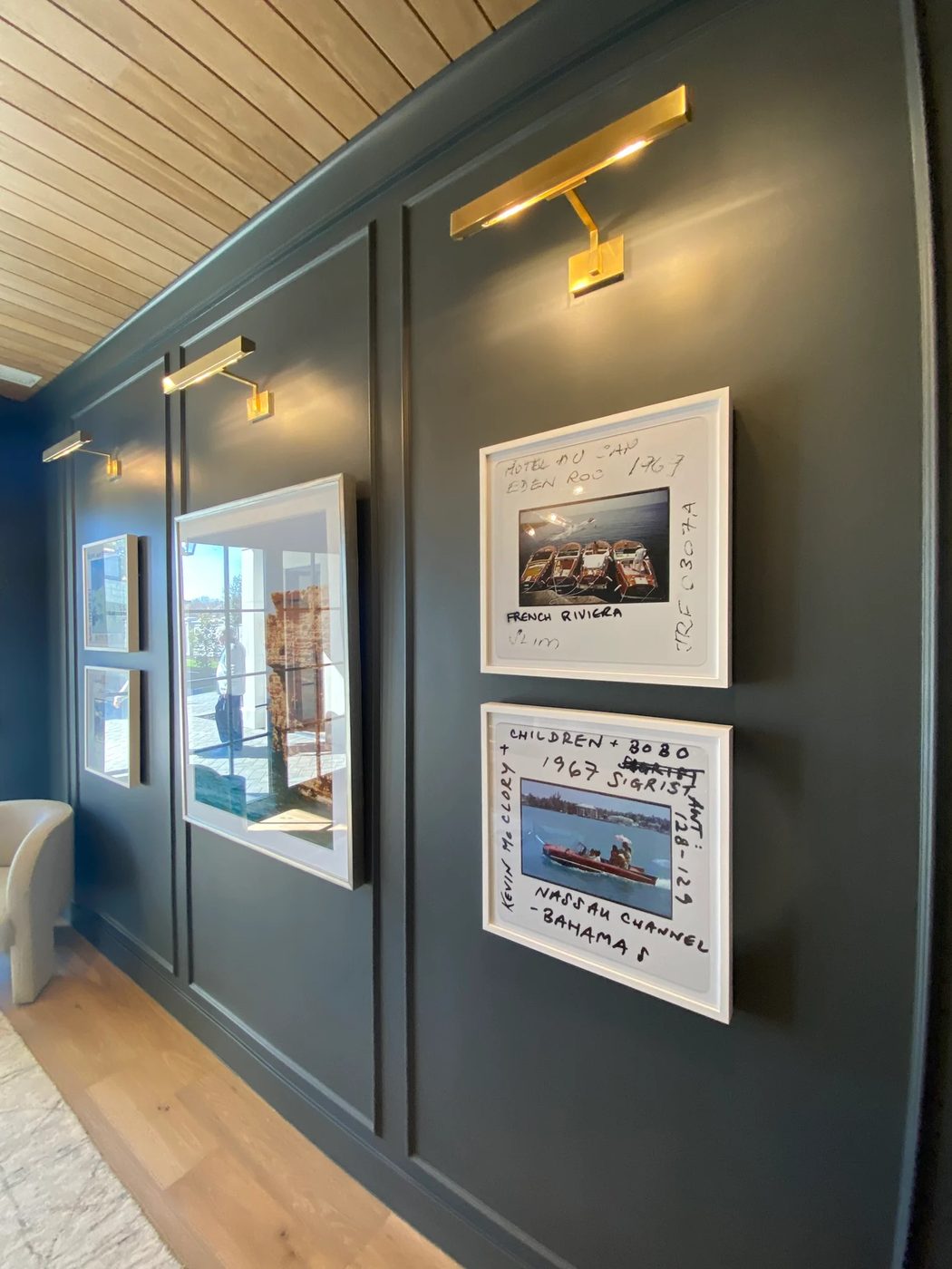 How to Decorate a Hallway: picture frame molding, picture lights, and art