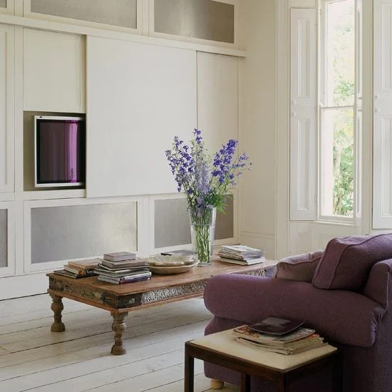 built-in cabinets with sliding panel to hide tv (House to Home)