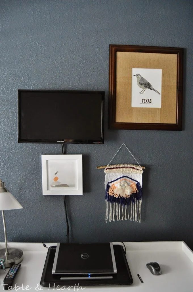 cover up TV cords with art (Table and Hearth)