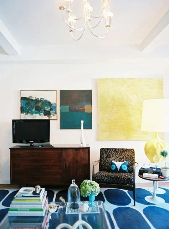 hang large art around the TV (via Apartment Therapy)