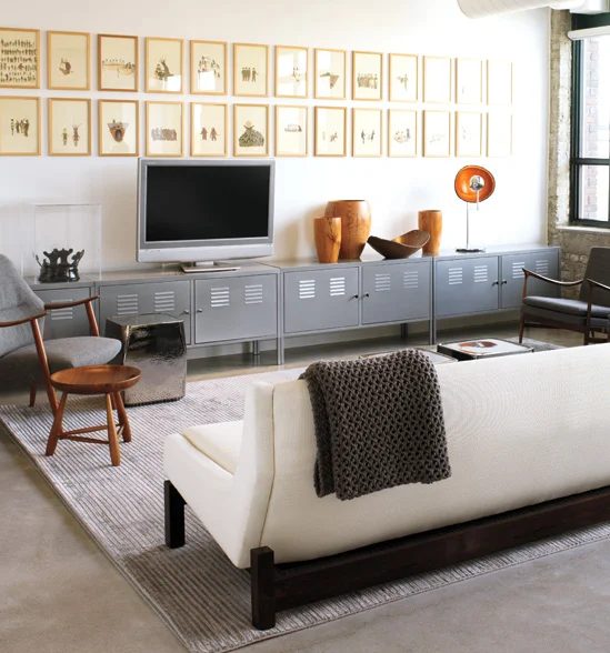 industrial living room with gallery wall above tv (Style at Home)