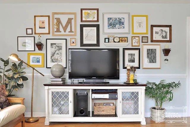 balanced gallery wall to disguise a tv (striking Matters)