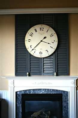shutters on a sliding closet rail to hdie a tv niche (Today's Creative Life)