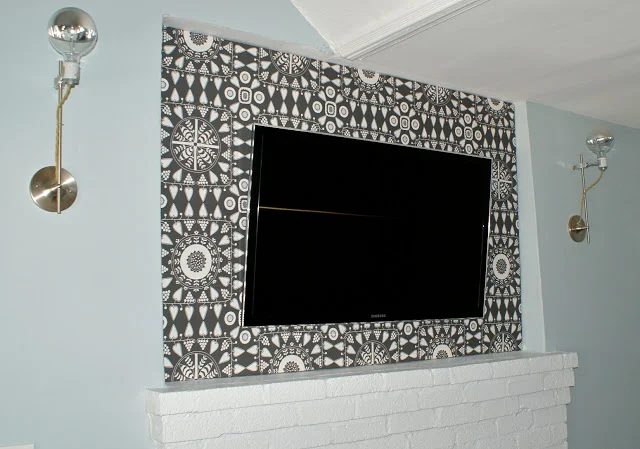 use a fabric panel to hide wall-mounted TV wires (mavenfresh)