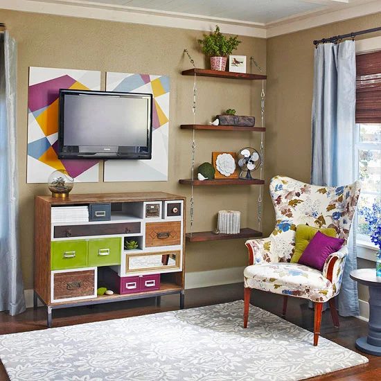painted art (on foamcore) behind the television (BHG)