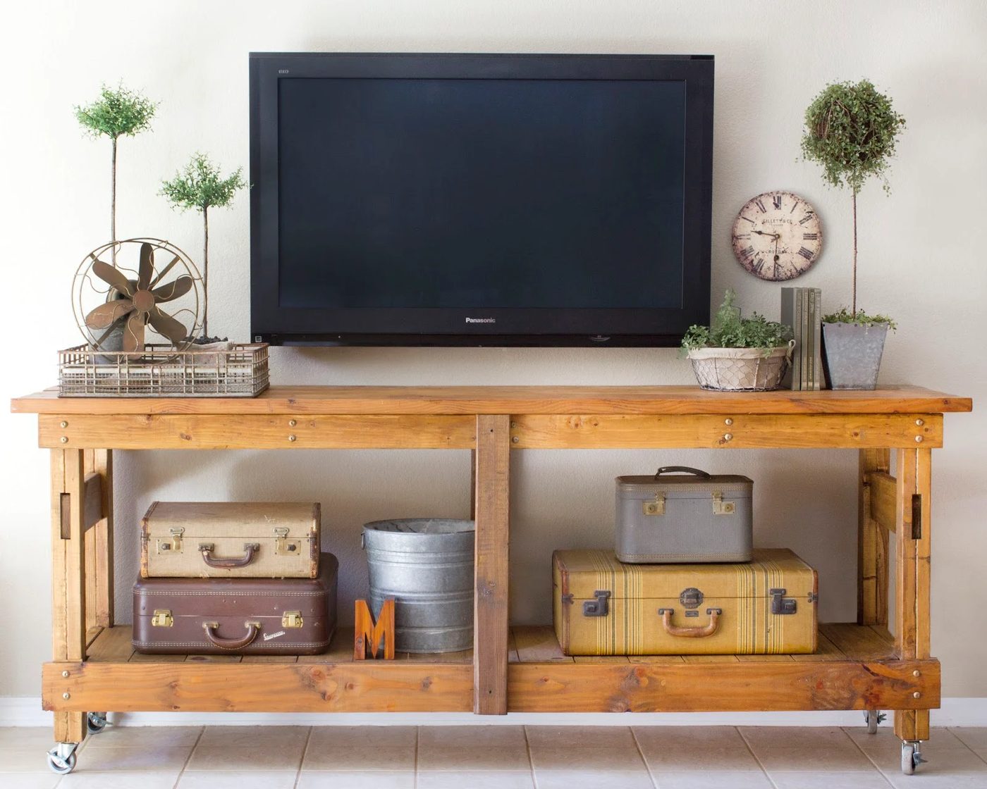 decorate around the TV with a workbench console and minimal decor (Brooklyn Limestone)