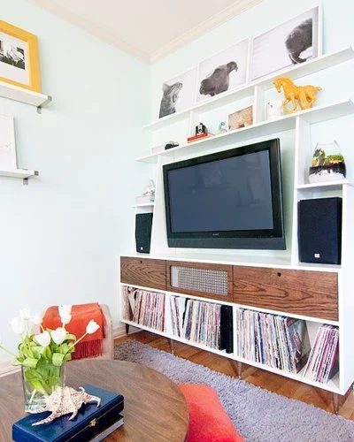 built-in storage and shelving around the TV (via Apartment Therapy)