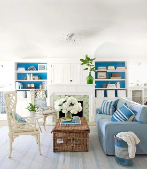 tuck away the television in a nook above the mantel (Country Living)