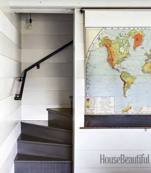 use a pull down map or shade to hide the television (House striking)