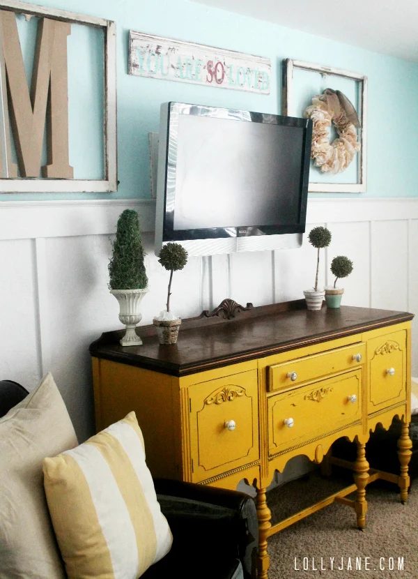 wall mounted tv with board and batten wainscoting and art (Lolly Jane)