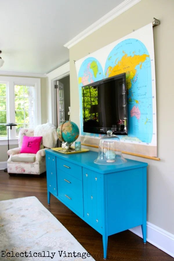 vintage dresser TV console with vintage map hung behind the TV (Eclectically Vintage)