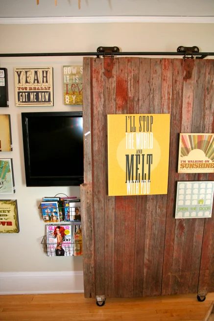 decorated sliding barn door to cover up the television (Bachmans Spring 2012 via Hirshfields)