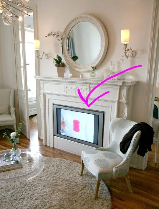 build a faux mantel to hide the TV (via Apartment Therapy)
