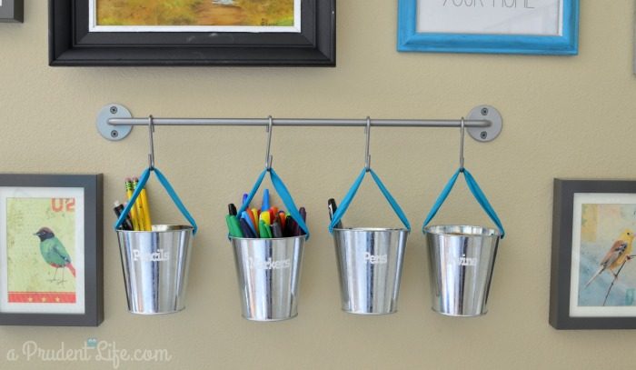 use inexpensive buckets and a wall storage rail for craft room storage, Polished Habitat