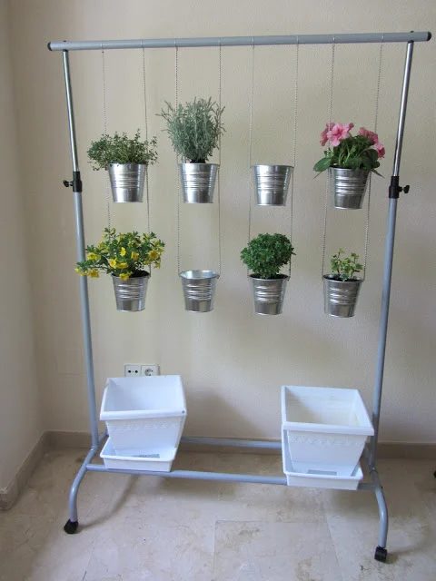 vertical hanging garden pots with a portable closet and inexpensive metal bucket planters from IKEA via millaveallen
