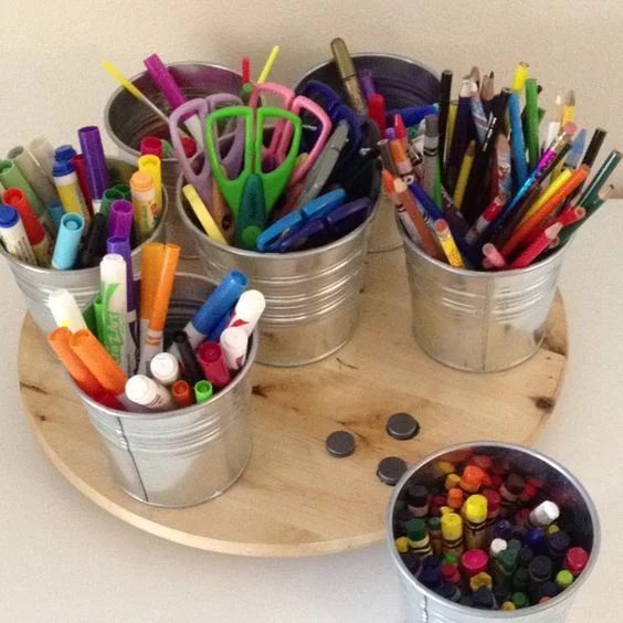 use a lazy susan and magnets with low-cost metal buckets from IKEA to make a great craft supply organizer for the kids @Bekob