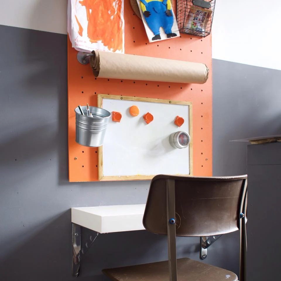 use IKEA buckets and wall rails on a pegboard for a kids art station by Grillo Designs