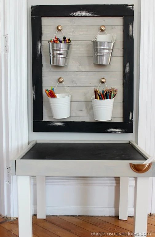 add rope handles to IKEA buckets for storage in a kids art station by Christina's Adventures