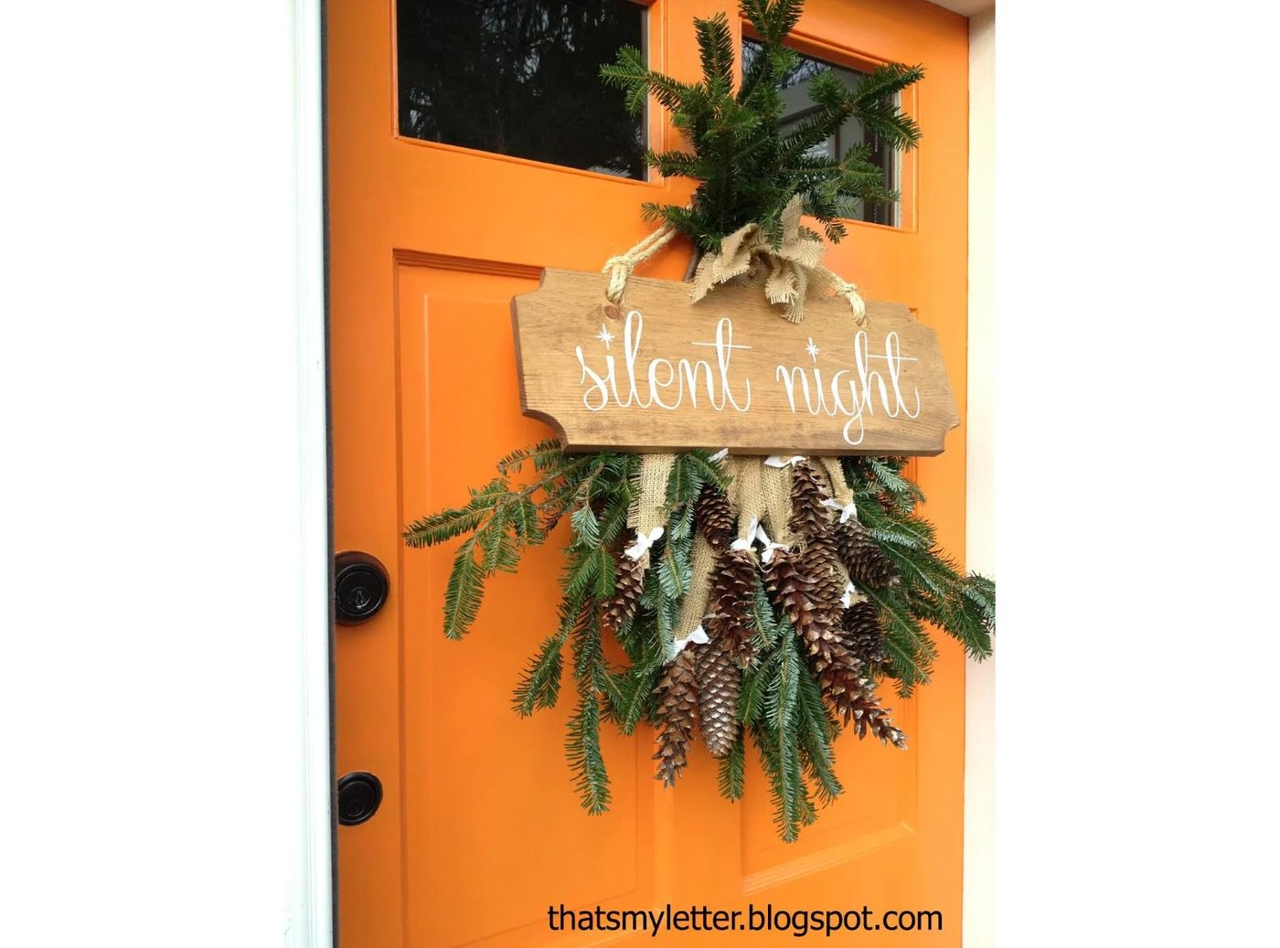 Silent Night Sign On A Pine Swag Front Door