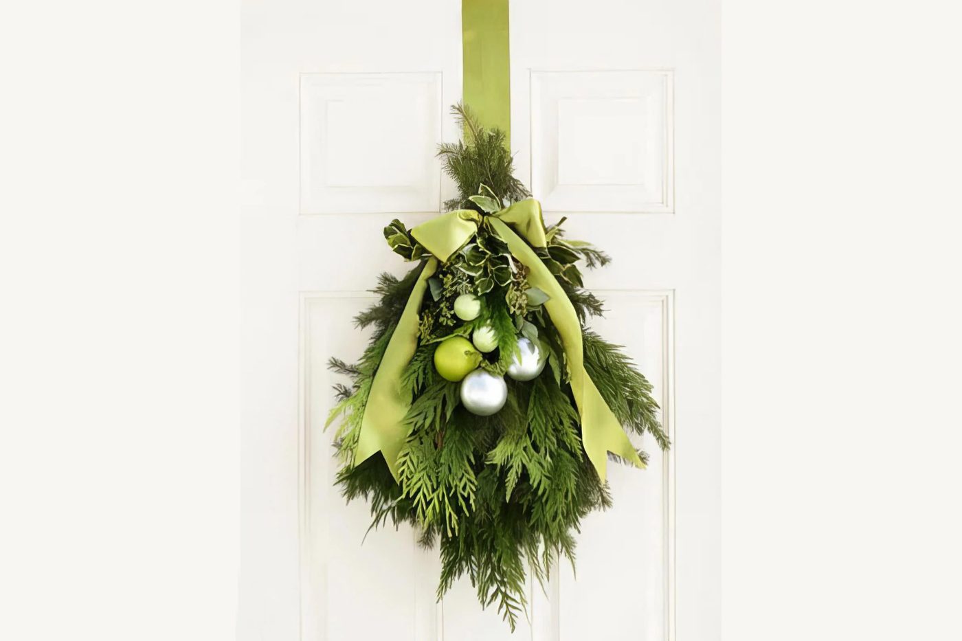 Evergreen And Ornament Door Swag Good Housekeeping Via @Bekob 020326