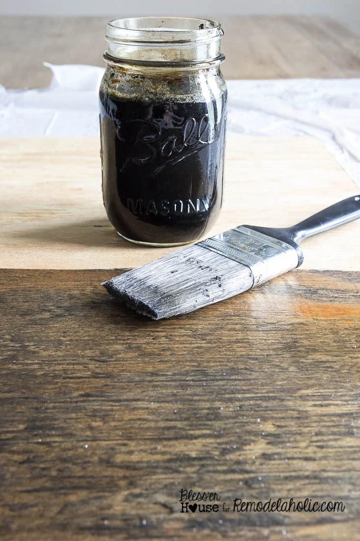 clearly straightforward homemade wood stain using a tea, steel wool, and vinegar combo for a well fitted rustic industrial color -- and then paint a chalkboard and add locker baske