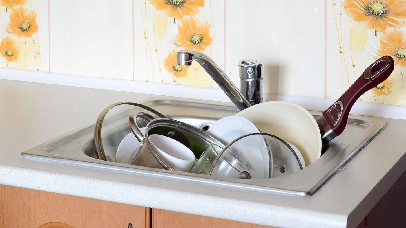 Kitchen Sink Full Of Dishes