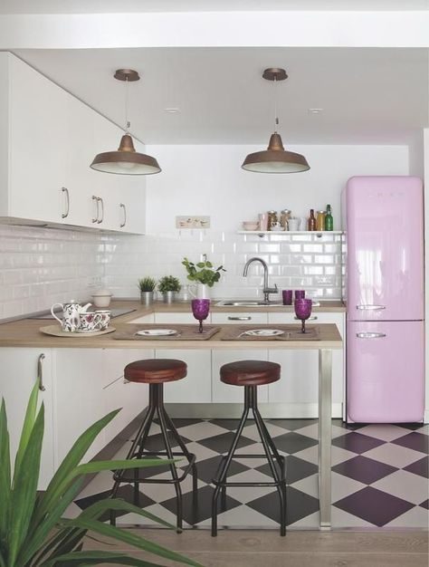Vintage Kitchen With Checkered Floor And Pink Fridge