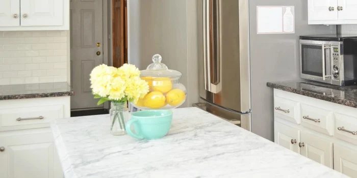 White Kitchen Overhaul with Handmade Marble Island