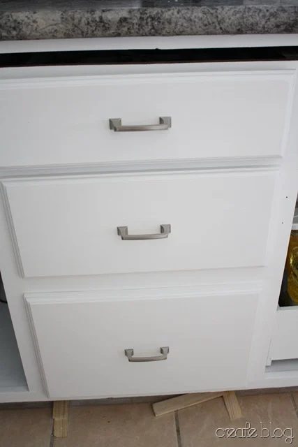 thrifted kitchen cabinets in a white kitchen remodel