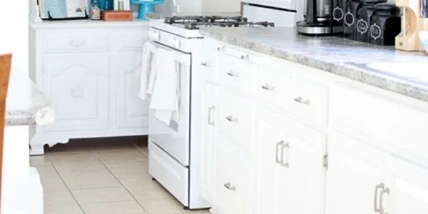 White Kitchen Remodel Using Thrifted Cabinets