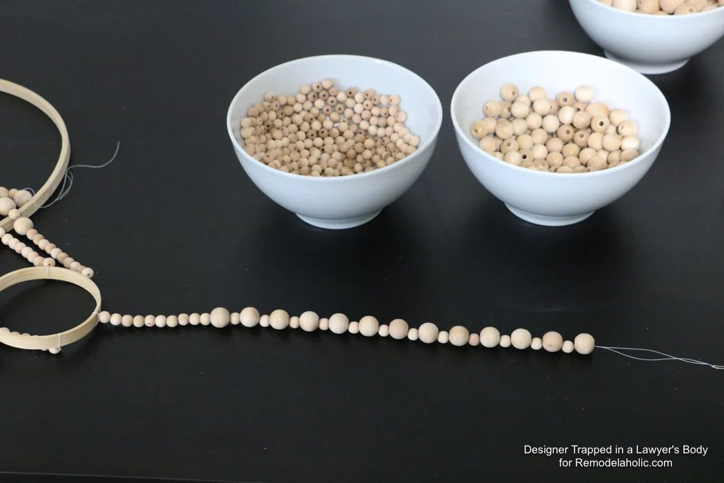WOW! Come learn how to make your own wood bead chandelier with this solid walkthrough by Designer Trapped in a Lawyer's Body for Bekob.com!