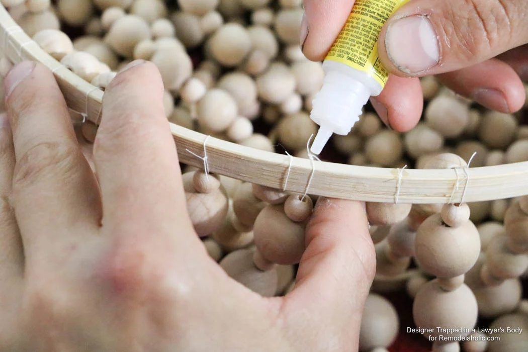 WOW! Come learn how to make your own wood bead chandelier with this solid walkthrough by Designer Trapped in a Lawyer's Body for Bekob.com!