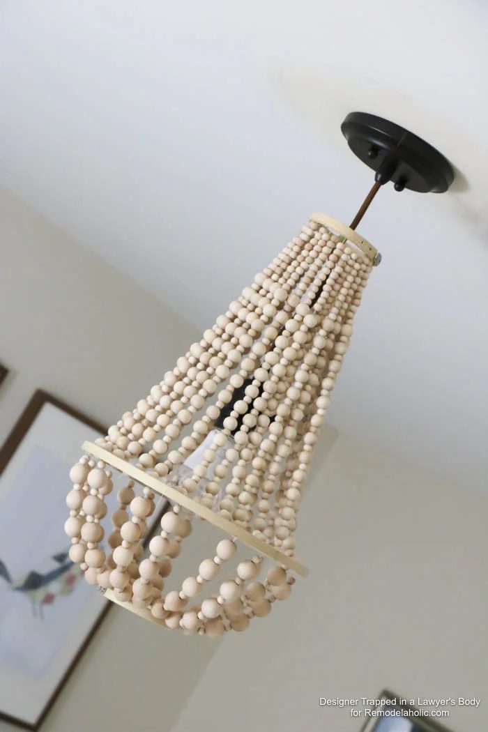 WOW! Come learn how to make your own wood bead chandelier with this solid walkthrough by Designer Trapped in a Lawyer's Body for Bekob.com!