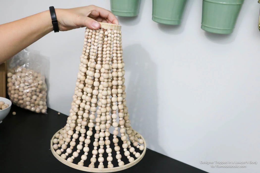 WOW! Come learn how to make your own wood bead chandelier with this solid walkthrough by Designer Trapped in a Lawyer's Body for Bekob.com!