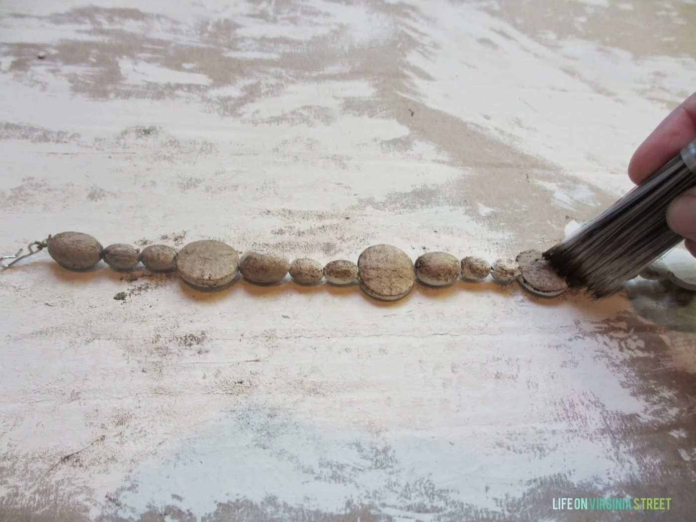 how to use Annie Sloan chalk paint and dark wax to create faux wood bead chandelier, Life on Virginia Street on Bekob