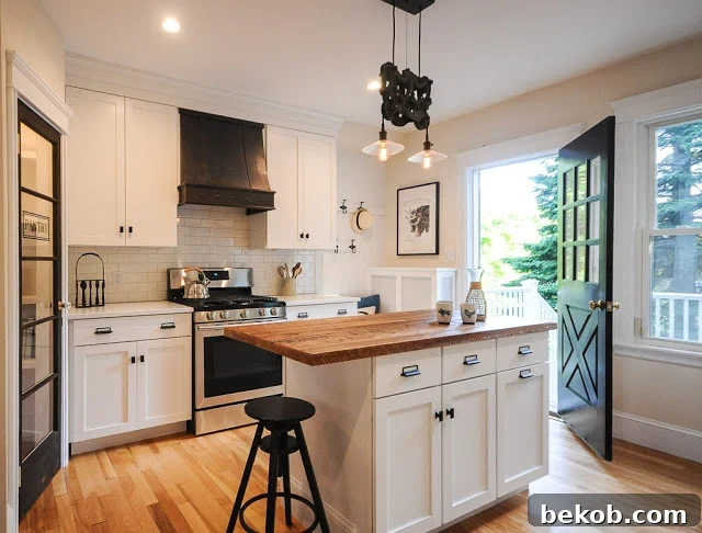 Bungalow Kitchen Remodel with Custom Range Hood, Glass Door Pantry, and Reclaimed Wood Island